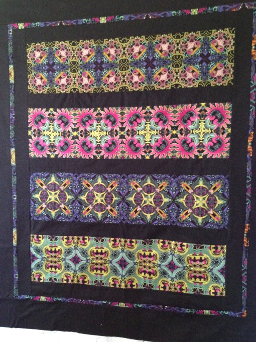 Portrait of completed quilt.  All tile-style rows are cut from the same mother cloth