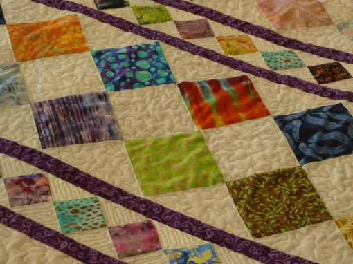 Detail of batik squares and quilting