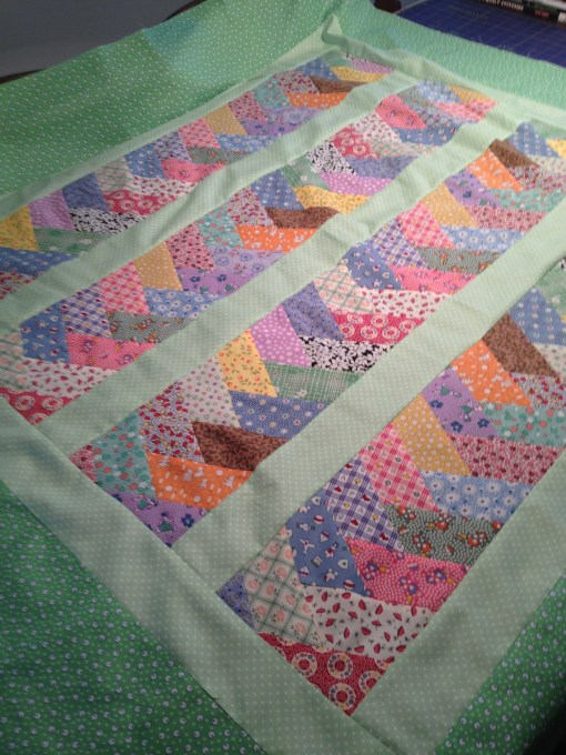 Pale sashing directs attention to focus fabrics