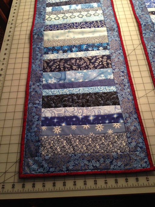 A variety of blues with dark red binding, and snowmen on the reverse.