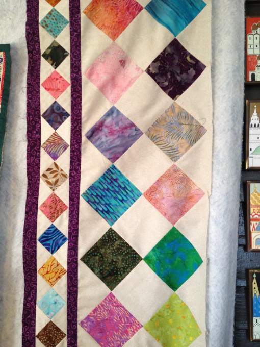 Two inch and four inch squares on point.