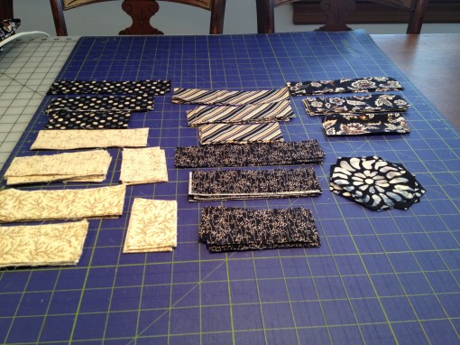 Fabrics cut into strips and bits,  and fussy-cut flowers